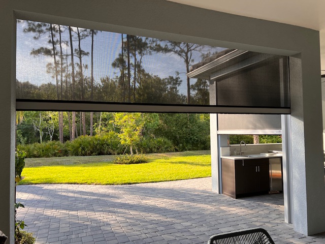 Motorized hurricane screens on a Sarasota outdoor living space