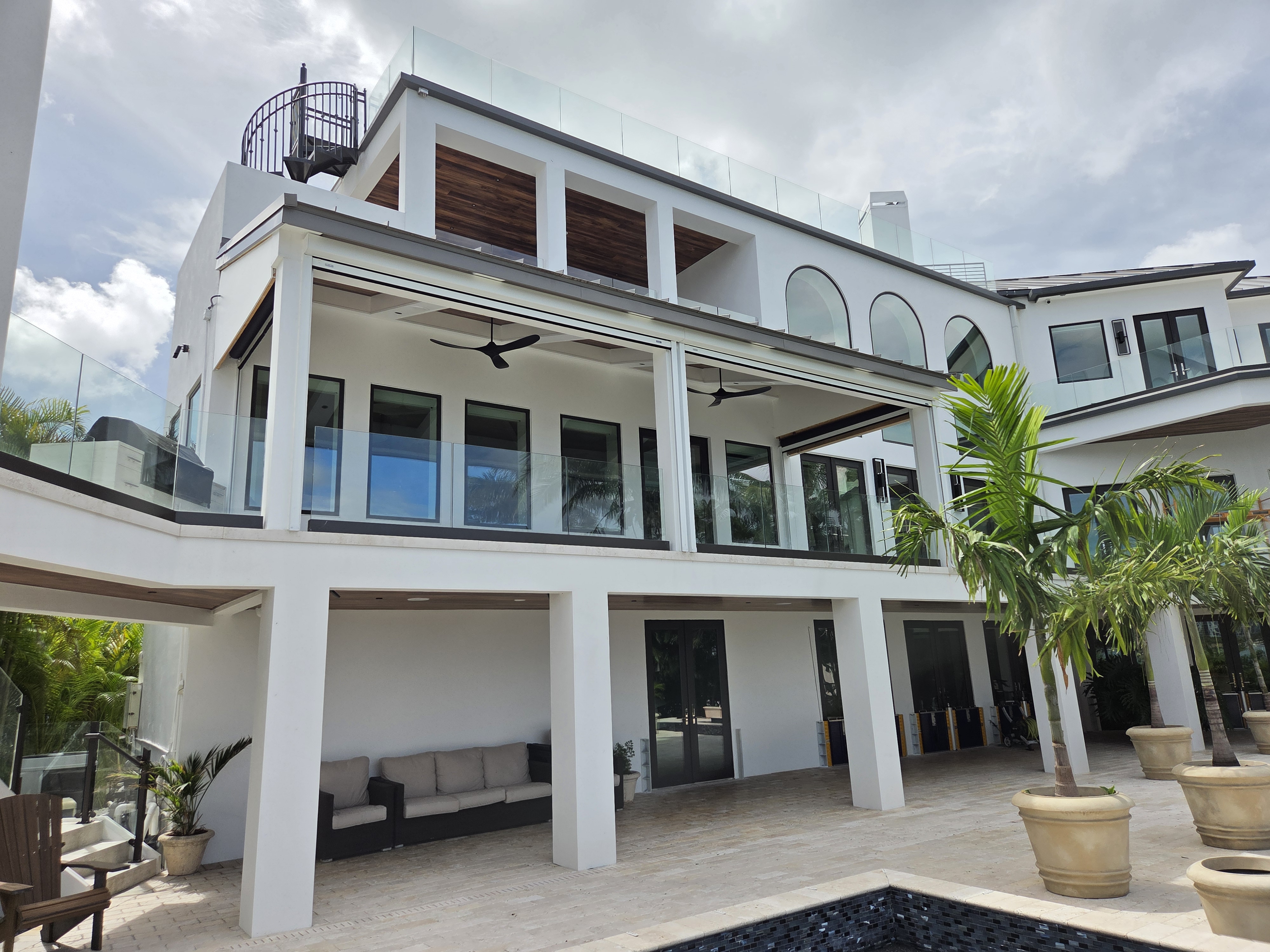 Motorized retractable screens on a luxury 3-story Sarasota waterfront home