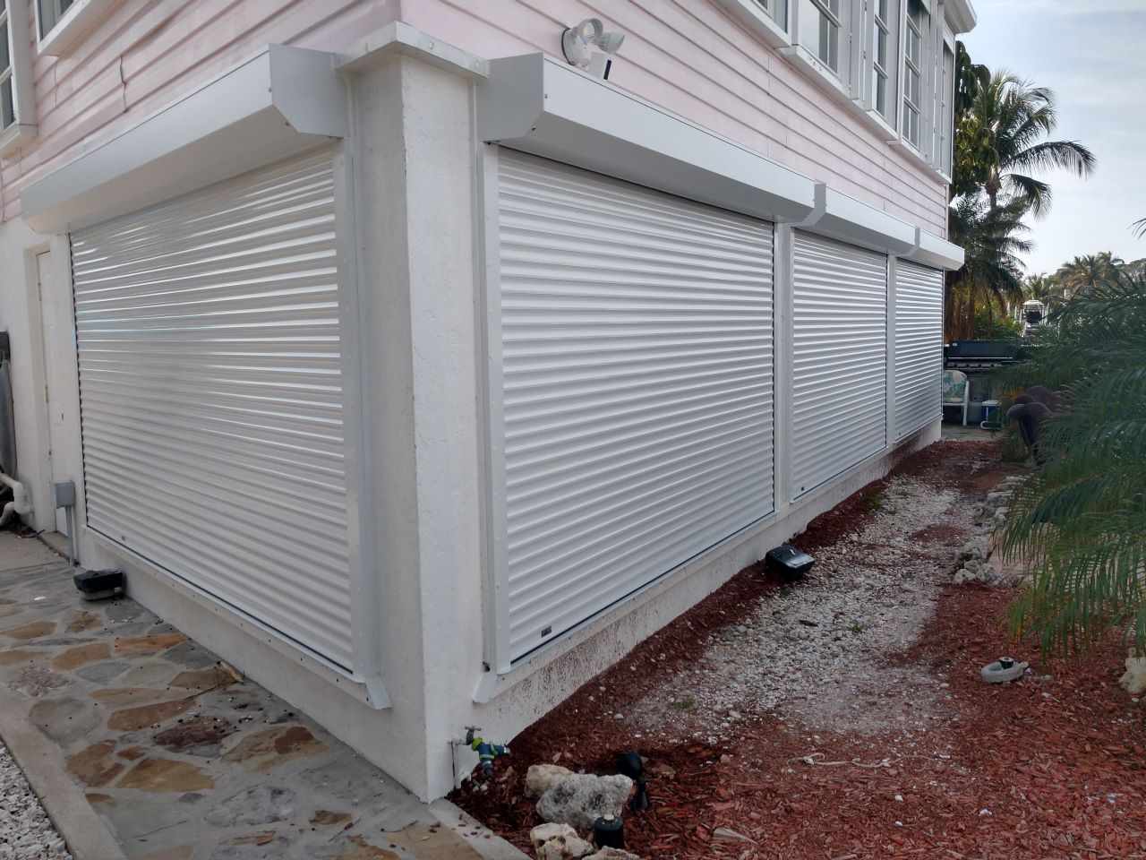 Roll-down hurricane shutters installed on a Sarasota home exterior